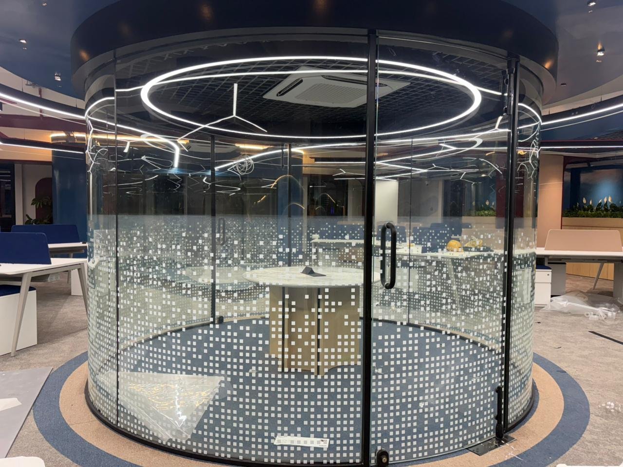 Curved premium glass partition with decorative frosted pixel film