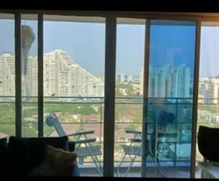 Balcony glass with blue tint film and city view