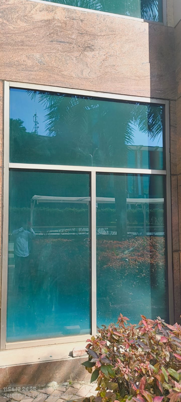 Exterior window with blue sun control film